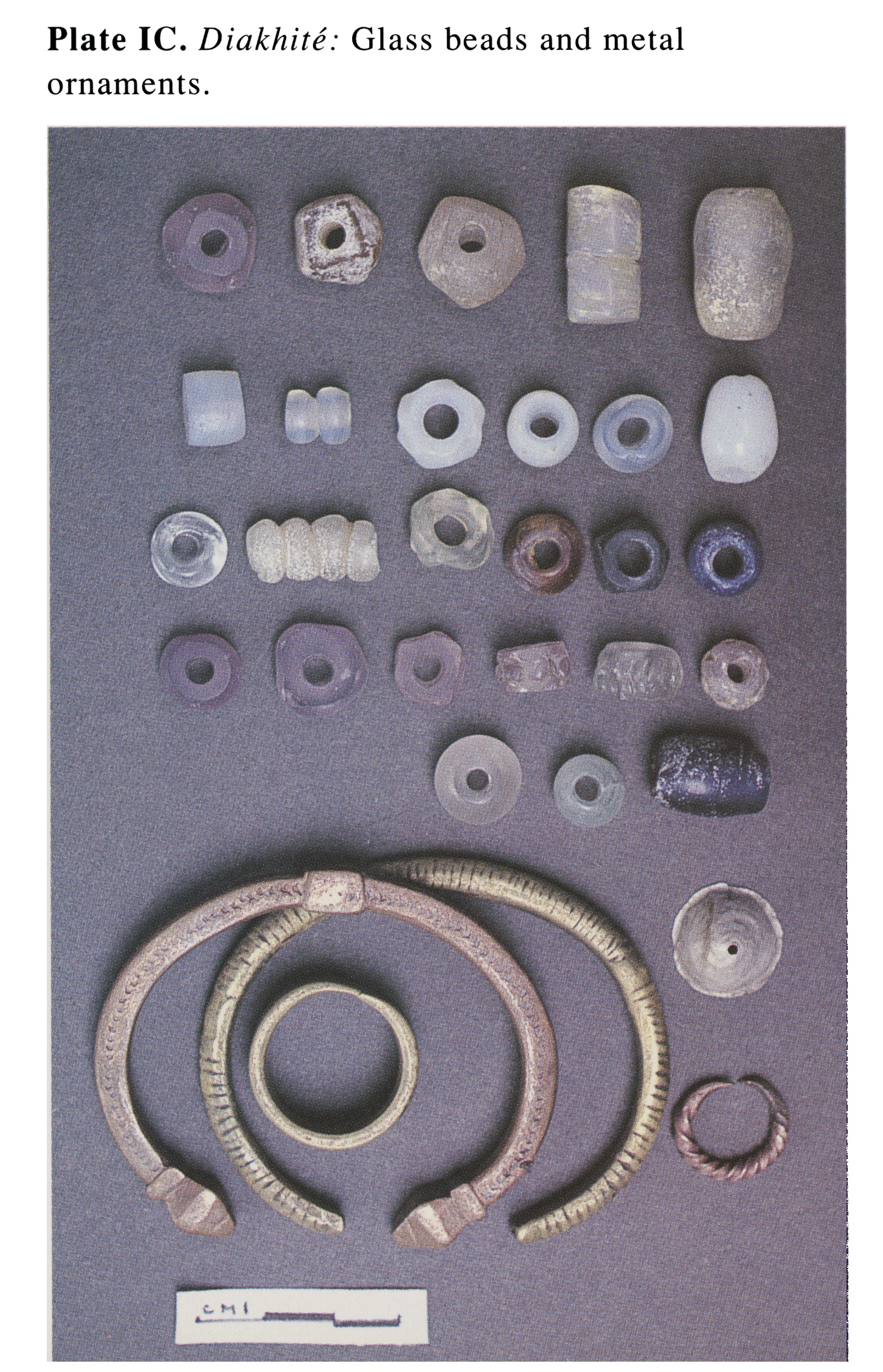 Plate IC Diakhite: Glass beads and metal ornaments.