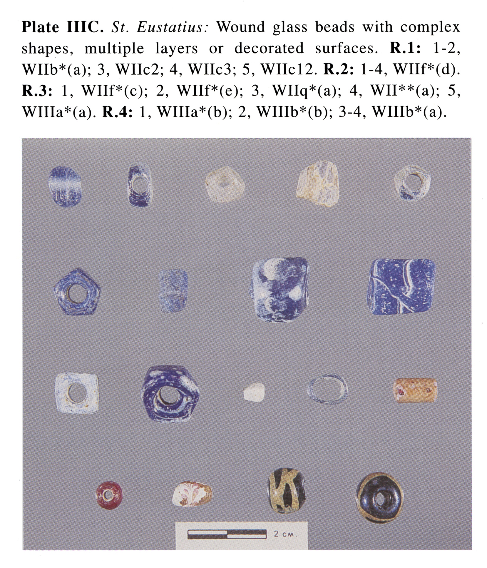 Plate IIIC St. Eustatius: Wound glass beads with complex shapes, multiple layers or decorated surfaces. R.1: 1-2, Wllb*(a); 3, Wllc2; 4, Wllc3; 5, Wllc12. R.2: 1-4, Wllf*(d). R.3: 1, Wllf*(c); 2, Wllf*(e); 3, Wllq*(a); 4, WII**(a); 5, WIIIa*(a). R.4: 1, WIIIa*(b); 2, WIIIb*(b); 3-4, WIIIb*(a). 