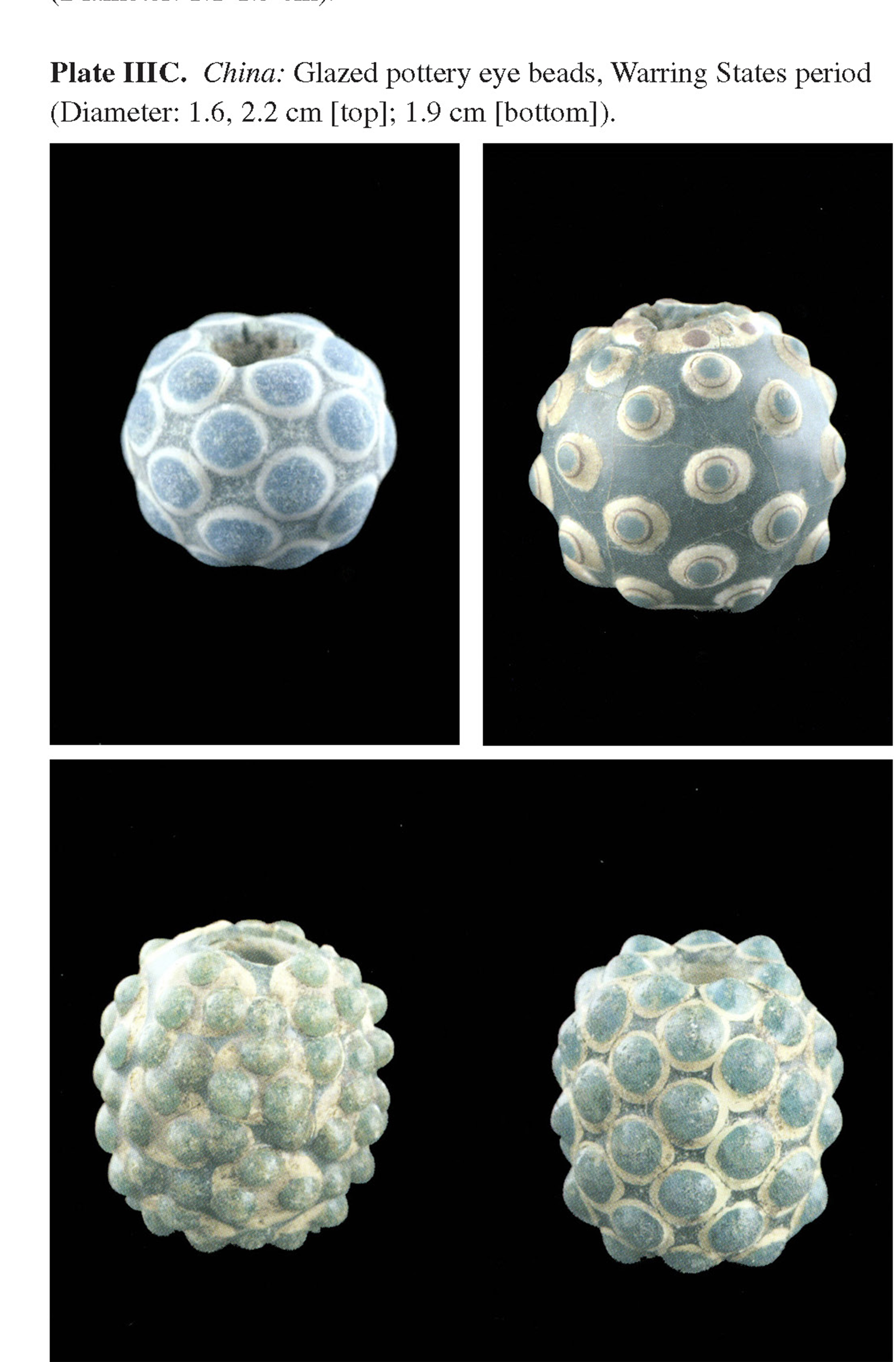 Plate IIIC China: Glazed pottery eye beads, Warring States period (Diameter: 1.6, 2.2 cm [top]; 1.9 cm [bottom]).