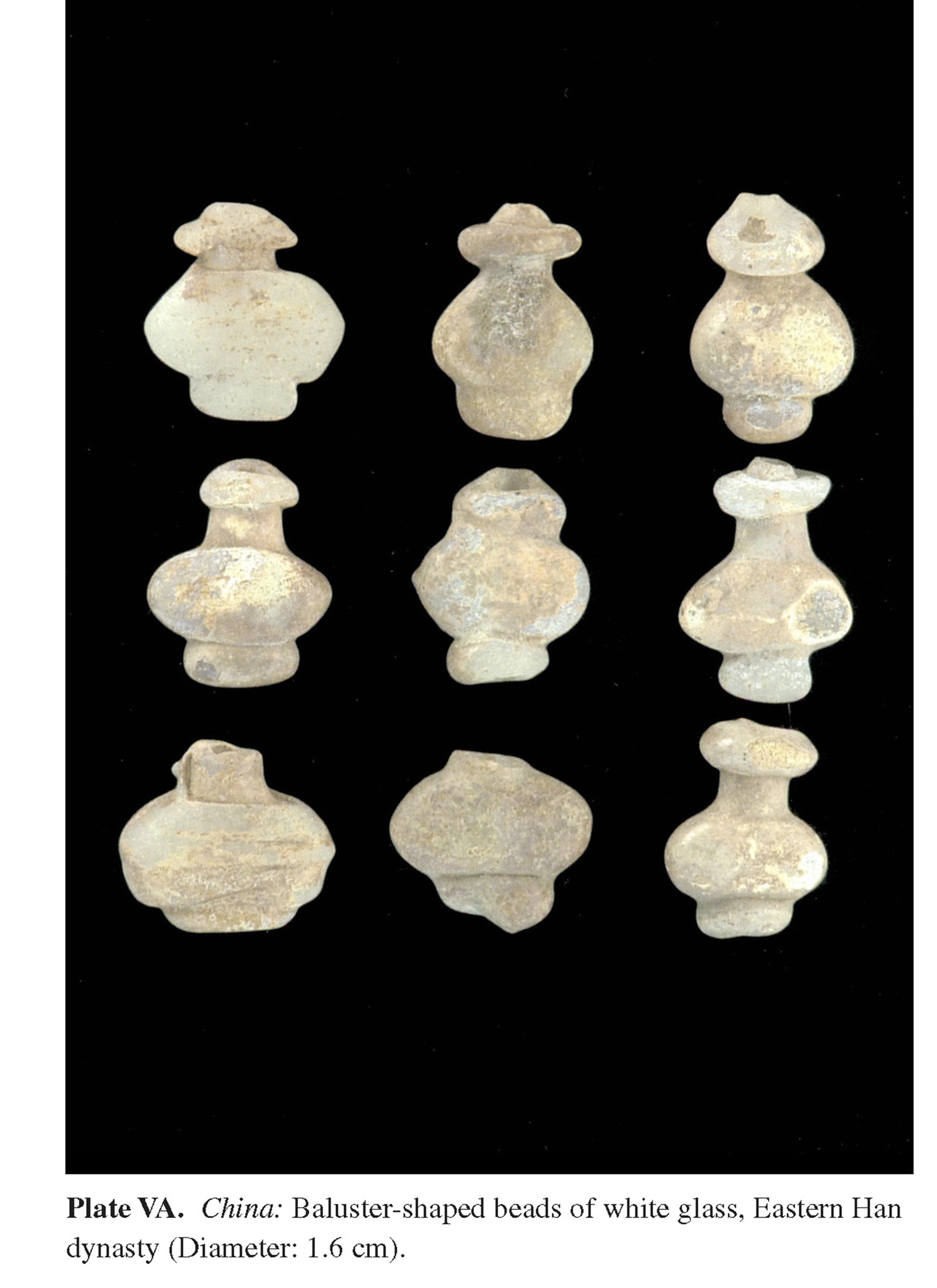 Plate VA China: Baluster-shaped beads of white glass, Eastern Han dynasty (Diameter: 1.6 cm).