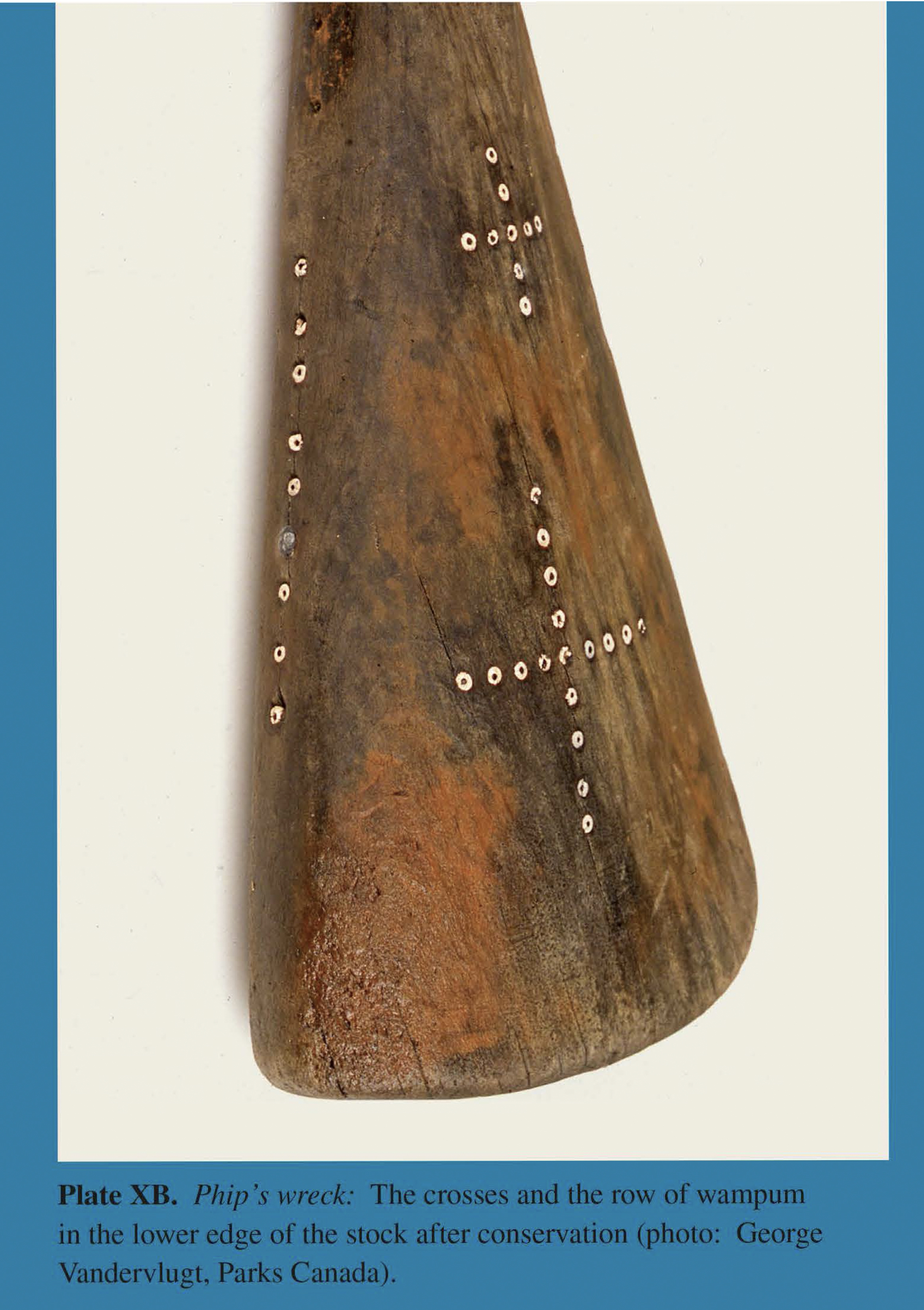 Plate XB Phip's wreck: The crosses and the row of wampum in the lower edge of the stock after conservation (photo: George Vandervlugt, Parks Canada).