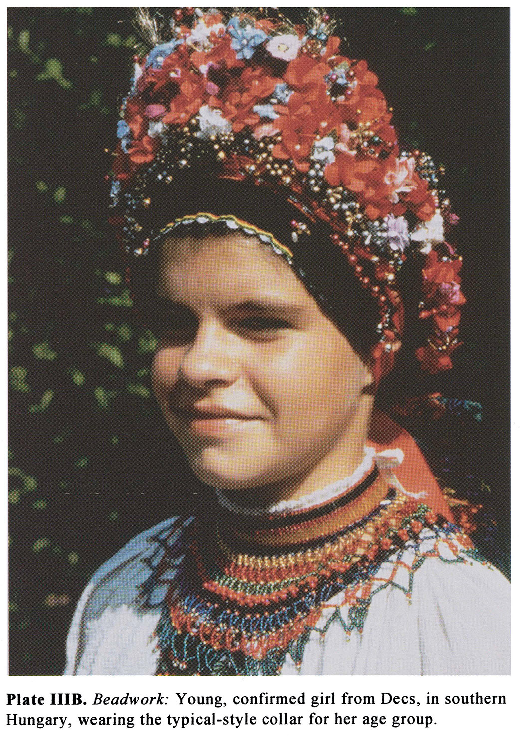 Plate IIIB Beadwork: Young, confirmed girl from Dees, in southern Hungary, wearing the typical-style collar for her age group.