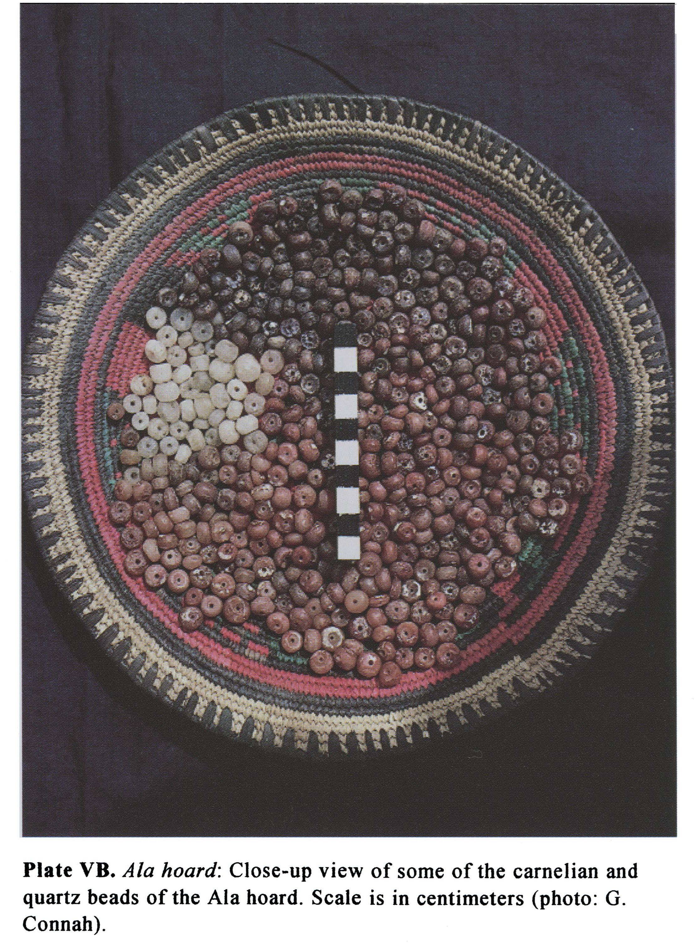 Plate VB Ala hoard: Close-up view of some of the carnelian and quartz beads of the Ala hoard. Scale is in centimeters (photo: G. Connah).