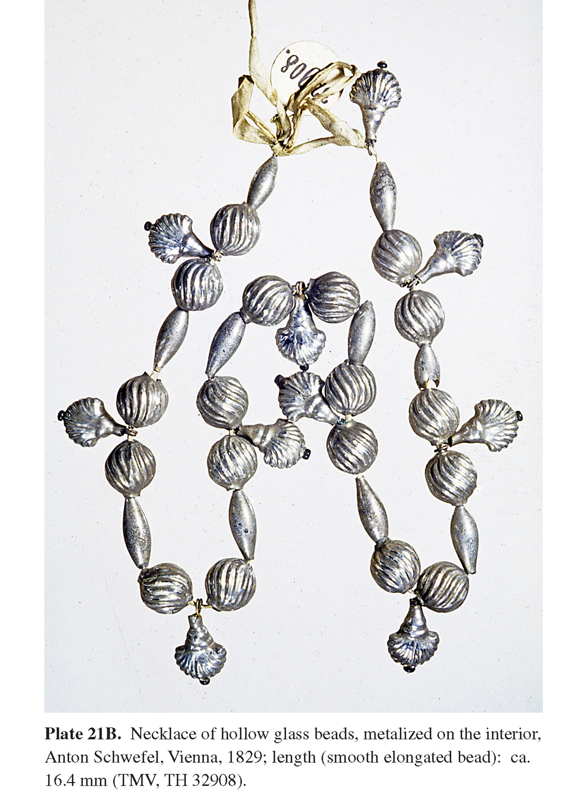 Plate 21B Necklace of hollow glass beads, metalized on the interior, Anton Schwefel, Vienna, 1829; length (smooth elongated bead): ca. 16.4 mm (TMV, TH 32908).