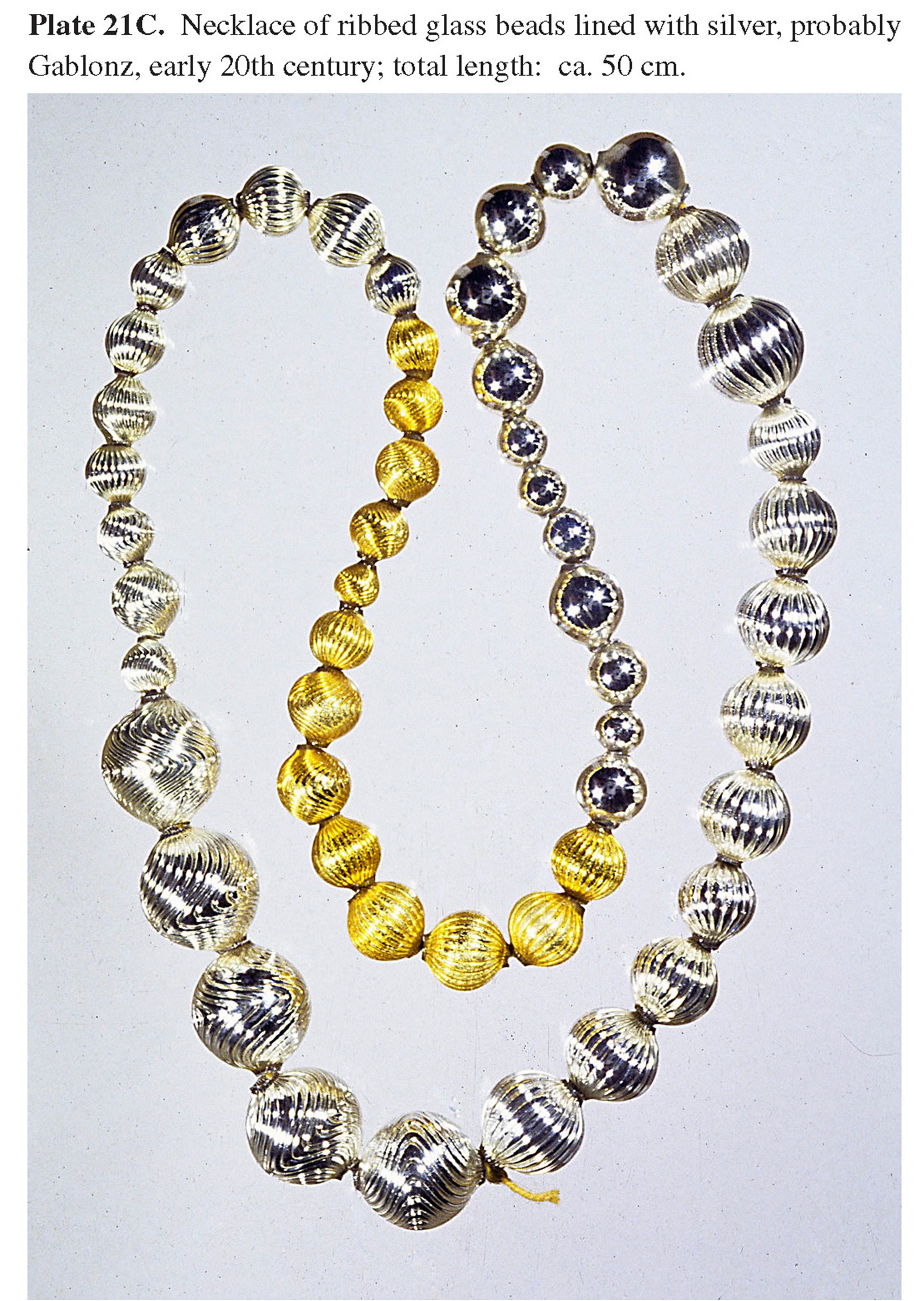 Plate 21C Necklace of ribbed glass beads lined with silver, probably Gablonz, early 20th century; total length: ca. 50 cm.