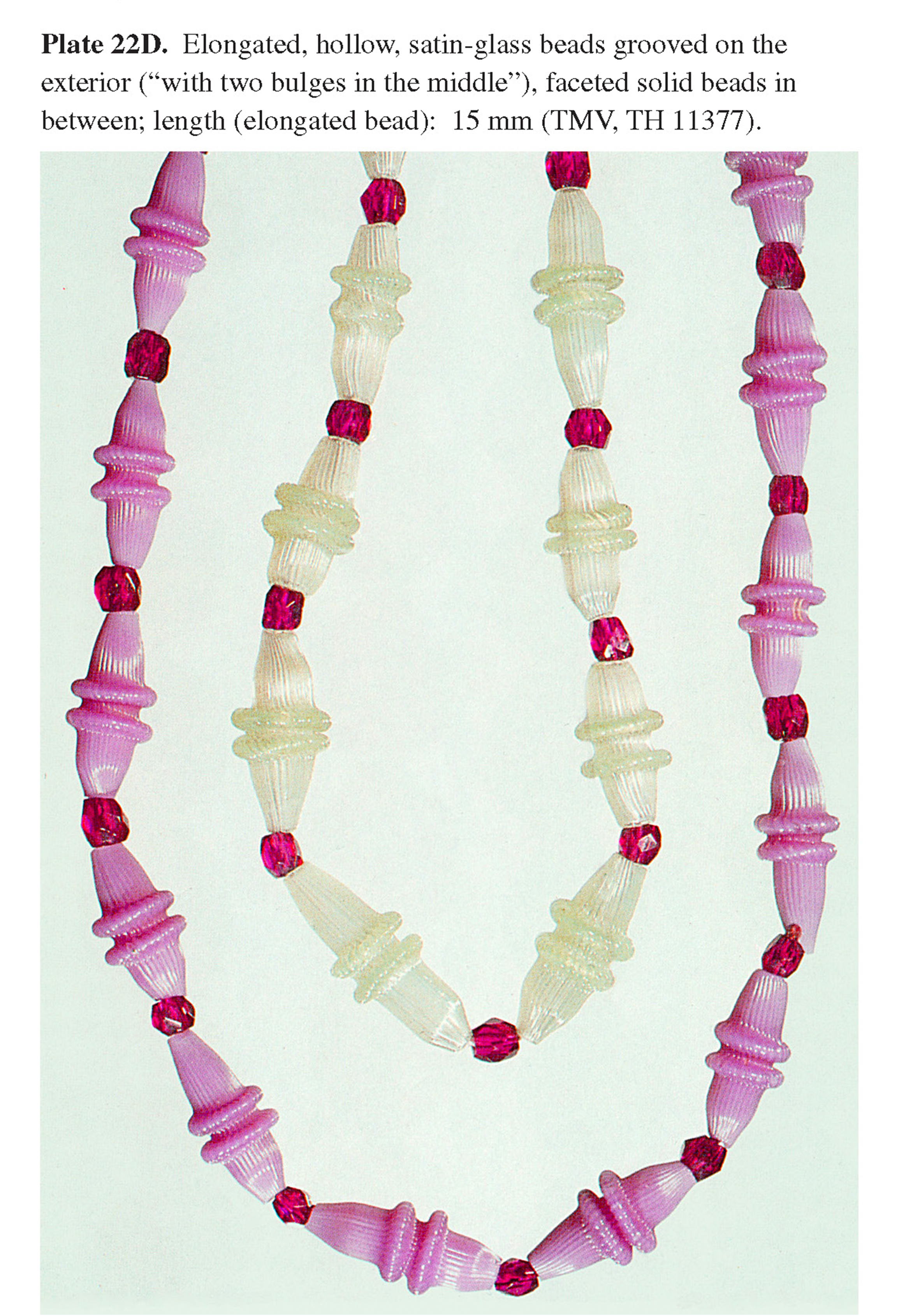 Plate 22D Elongated, hollow, satin-glass beads grooved on the exterior (“with two bulges in the middle”), faceted solid beads in between; length (elongated bead): 15 mm (TMV, TH 11377).