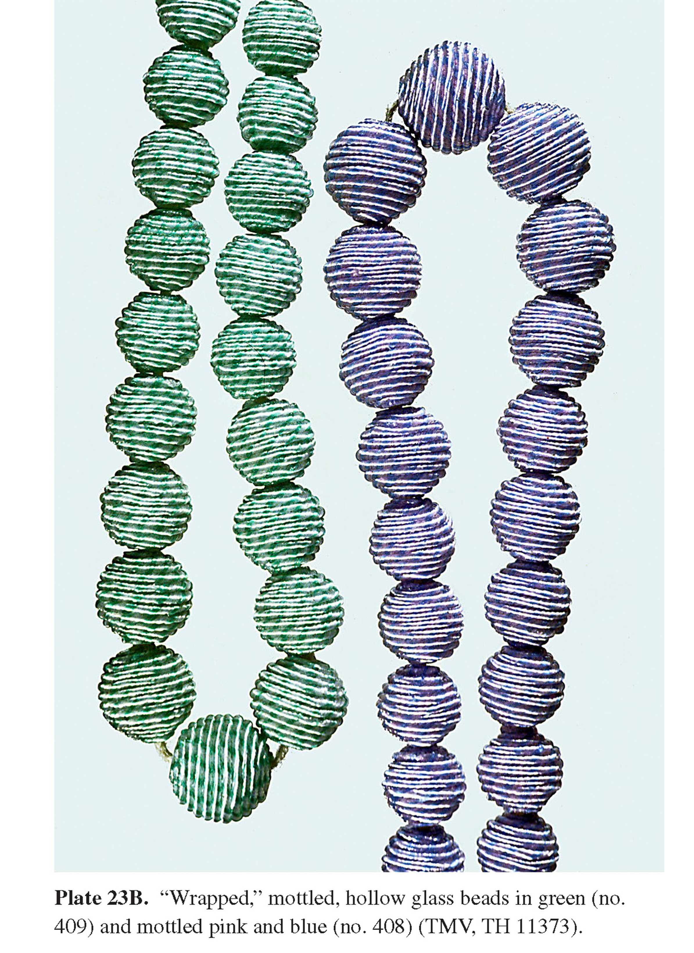 Plate 23B “Wrapped,” mottled, hollow glass beads in green (no. 409) and mottled pink and blue (no. 408) (TMV, TH 11373).
